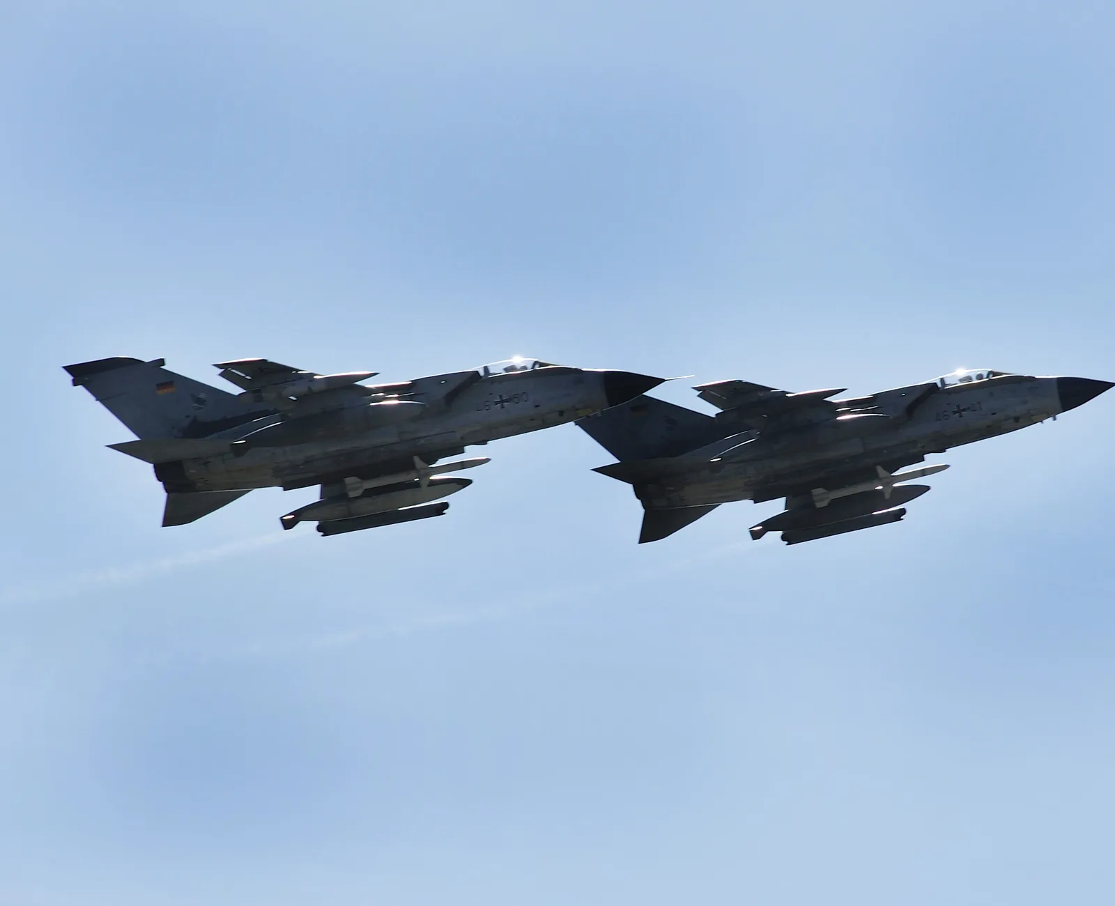 Two Luftwaffe Tornado ECR electronic-combat aircraft in flight against a clear sky.